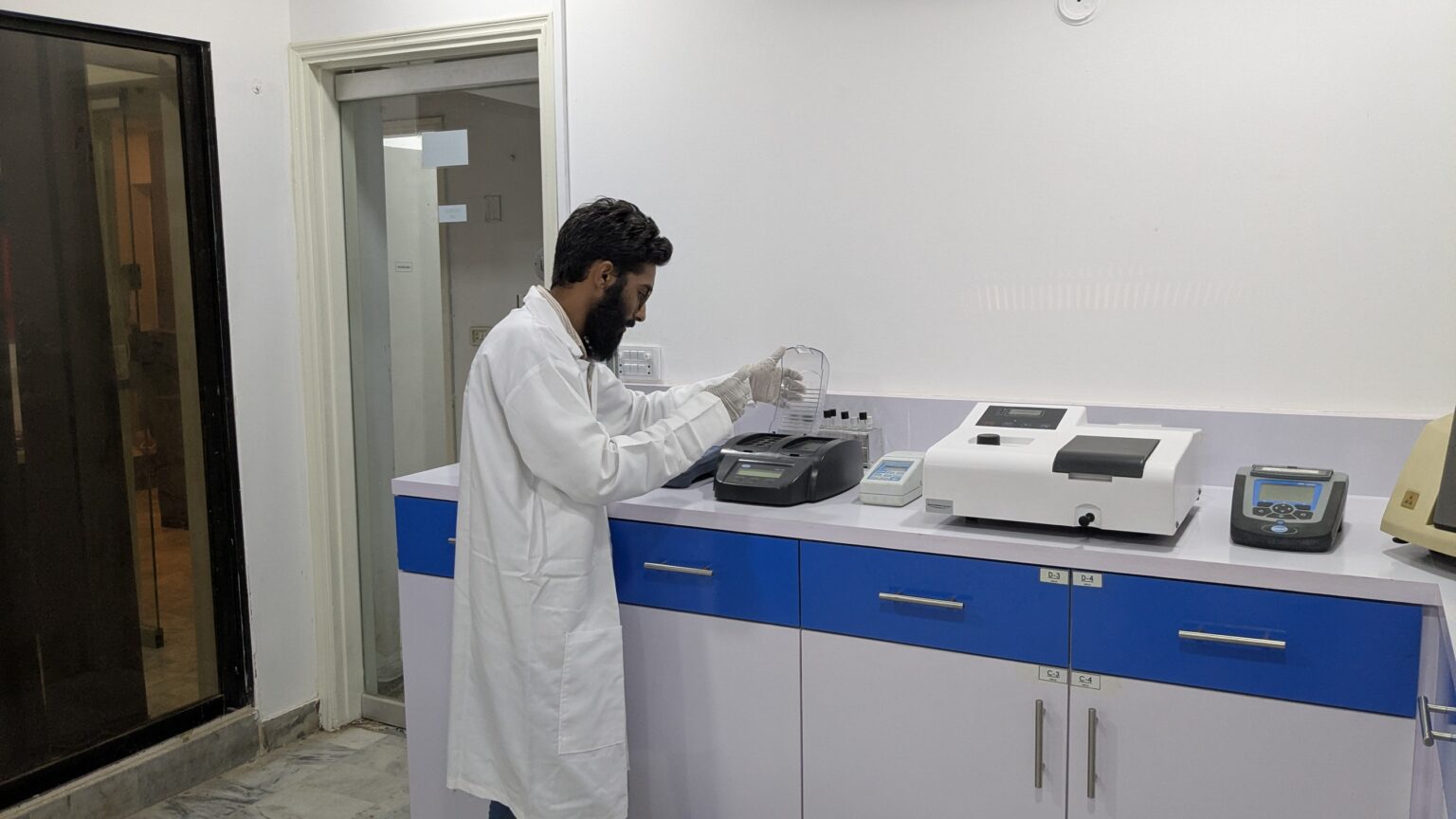 DUCOM analyst testing samples at the analytical laboratory bench