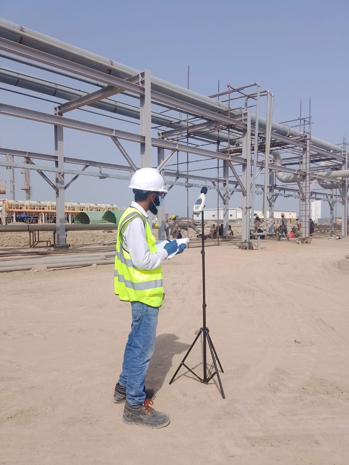 DUCOM field technician carrying out ambient air quality monitoring at an industrial site
