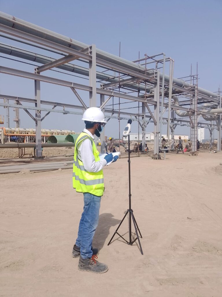 DUCOM field technician carrying out ambient air quality monitoring at an industrial site